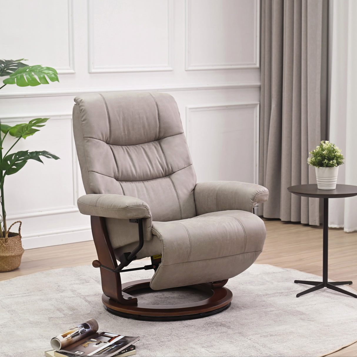 A room setting featuring Valencia Light Gray Swivel Recliner with Flip Up Footrest