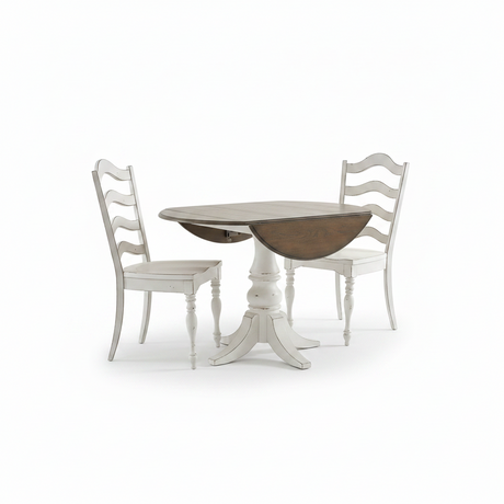 A round drop-leaf dining table with a whitewashed pedestal base and two matching white ladder-back chairs, shown on a clean white background.