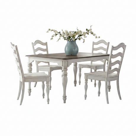 A 5-piece dining set featuring a rectangular table with a dark brown wood top and distressed white turned legs, surrounded by four matching ladder-back chairs in distressed white. A light blue ceramic vase filled with white blossoms sits on the table.