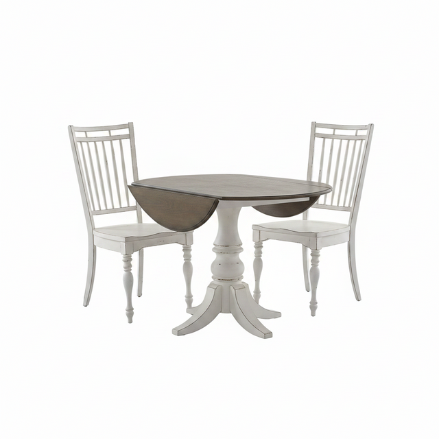 A three-piece dining set featuring a round pedestal table with drop-leaf wood tops and two matching white spindle-back chairs, shown on a plain white background.