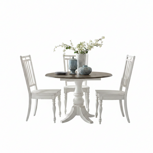 A 5-piece dining set featuring a round pedestal table with a dark brown wood-grain top and three matching white spindle-back chairs, styled with decorative vases and flowers on a clean white background.