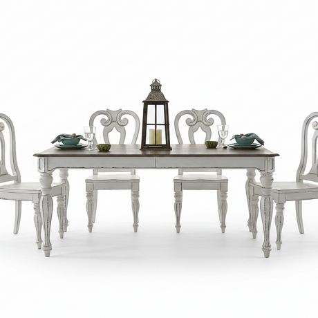 A white distressed dining table set with six matching chairs, a dark wood lantern centerpiece, and teal place settings on a clean white background.