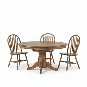 A round wooden dining table with a pedestal base, accompanied by four matching spindle-back chairs, photographed on a clean white studio background.