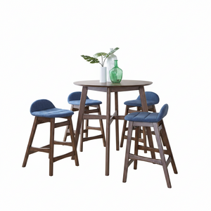 A 5-piece bar-height dining set featuring a round wooden table and four matching stools with blue upholstered seats, shown on a plain white background with decorative vases and a plant.