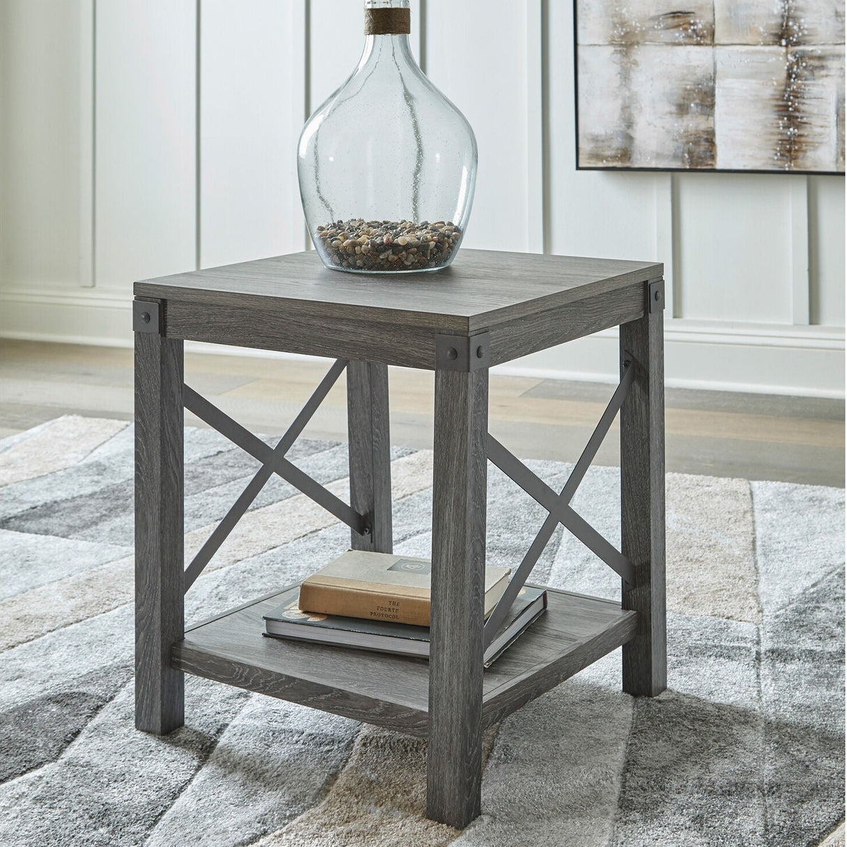 A room setting featuring Freedan Grayish Brown End Table
