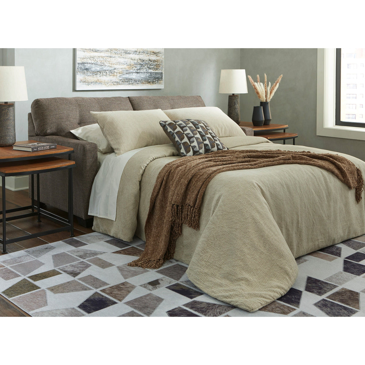 A room setting featuring Mahoney Chocolate Full Sofa Sleeper