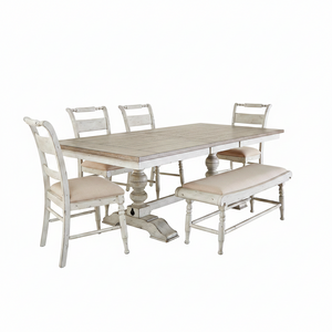A six-piece trestle dining set with a planked top and turned pedestals, accompanied by four side chairs with upholstered seats in a linen fabric, placed in a room with a hanging lantern, mirror, and decorative objects.