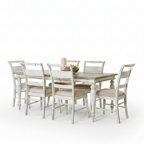 A 7-piece dining set consisting of a rectangular table with a dark brown wood top and white distressed legs, surrounded by six matching chairs with white distressed frames and beige upholstered seats, shown on a solid white background.