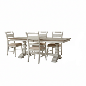 A rustic 5-piece dining room set featuring a rectangular pedestal table and six matching chairs with distressed off-white frames and light beige upholstered seats, shown on a solid white background.