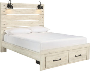 A light natural wood platform bed frame with two storage drawers at the foot, dressed in white bedding, featuring a tall slatted headboard with two black wall-mounted sconces.