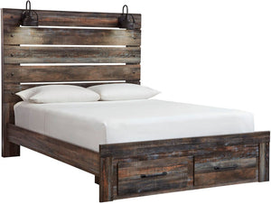 A rustic reclaimed wood bed frame with a tall slatted headboard, matching footboard, and built-in storage drawers at the bottom. The bed is dressed in white bedding and two white pillows, with two black metal wall sconces mounted above the headboard, shown against a plain white background.