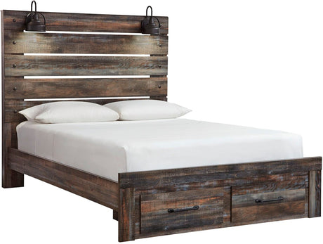 A rustic reclaimed wood bed frame with a tall slatted headboard, matching footboard, and built-in storage drawers at the bottom. The bed is dressed in white bedding and two white pillows, with two black metal wall sconces mounted above the headboard, shown against a plain white background.