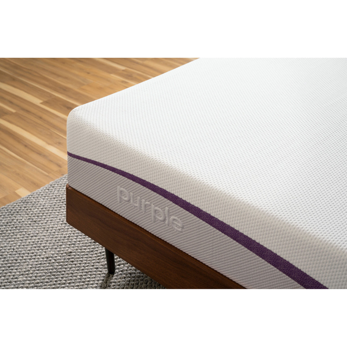 The Purple Mattress corner logo
