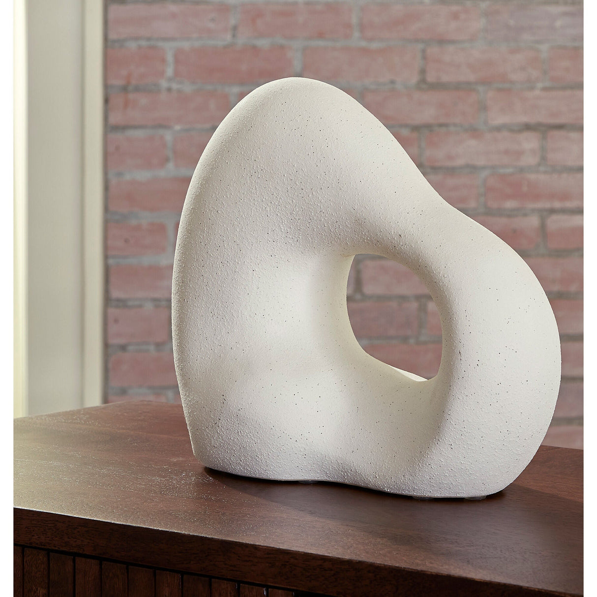 A room setting featuring Arthrow Off White Small Sculpture