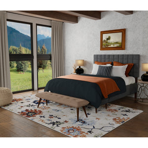 A room setting featuring Melrose Ivory 5x8 Rug