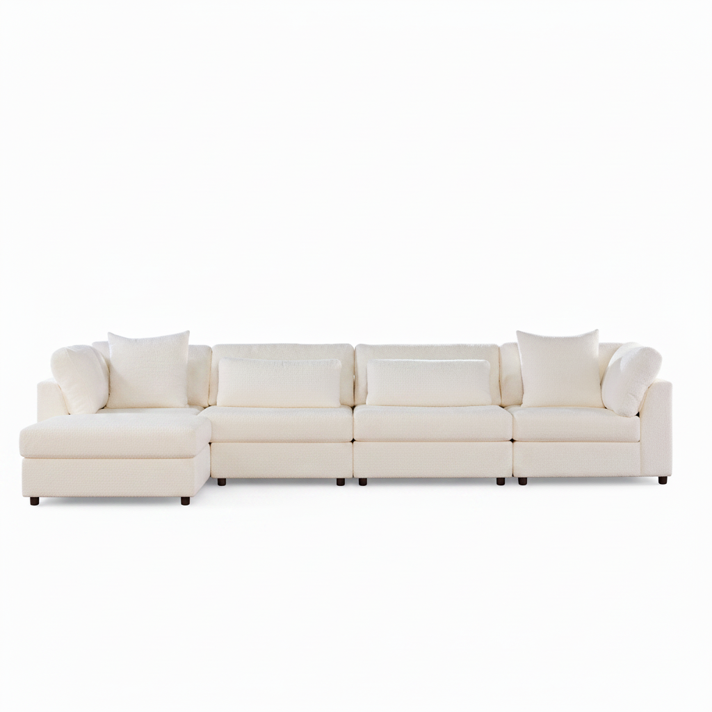 A modern sectional sofa in off-white upholstery with matching throw pillows, shown from a straight-on angle against a plain white background.