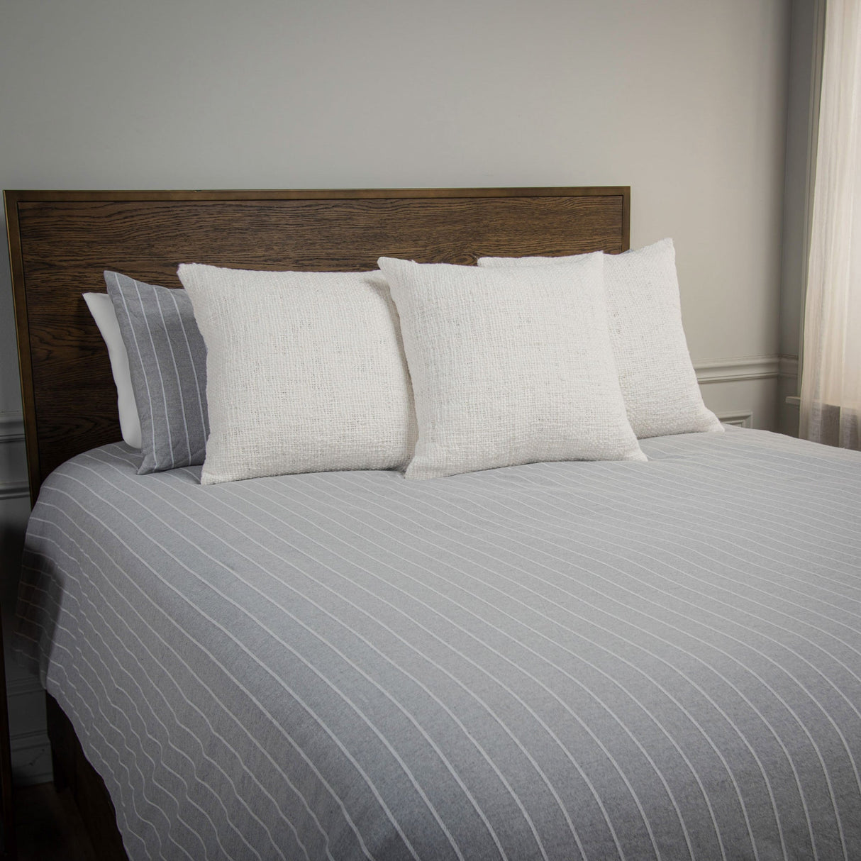 Grey Willow Lane Comforter and pillows on bed iso view