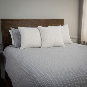 Grey Willow Lane Comforter and pillows on bed iso view