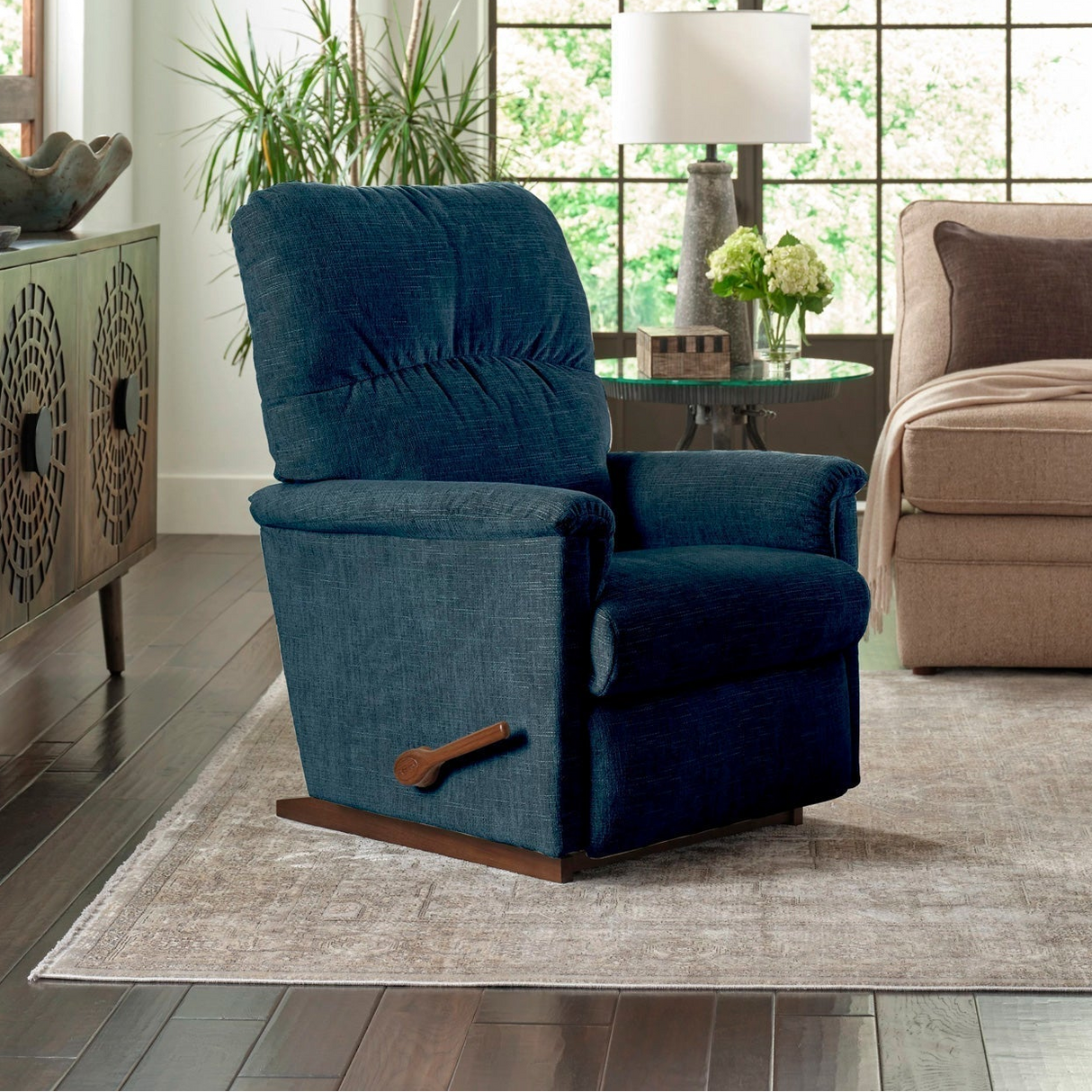 A room setting featuring Collage Navy Rocker Recliner