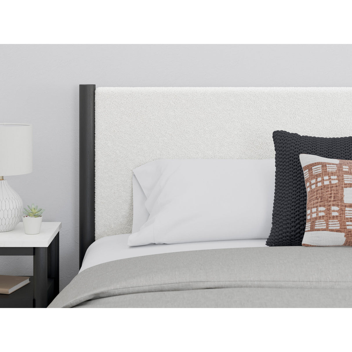 Detail view of Cadmori Black King 4 Piece Upholstered Room Group