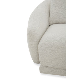 Light gray sofa with a wooden tray attached to it on a white background