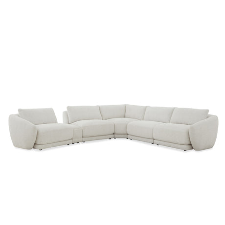 Sectional sofa in light gray on a white background