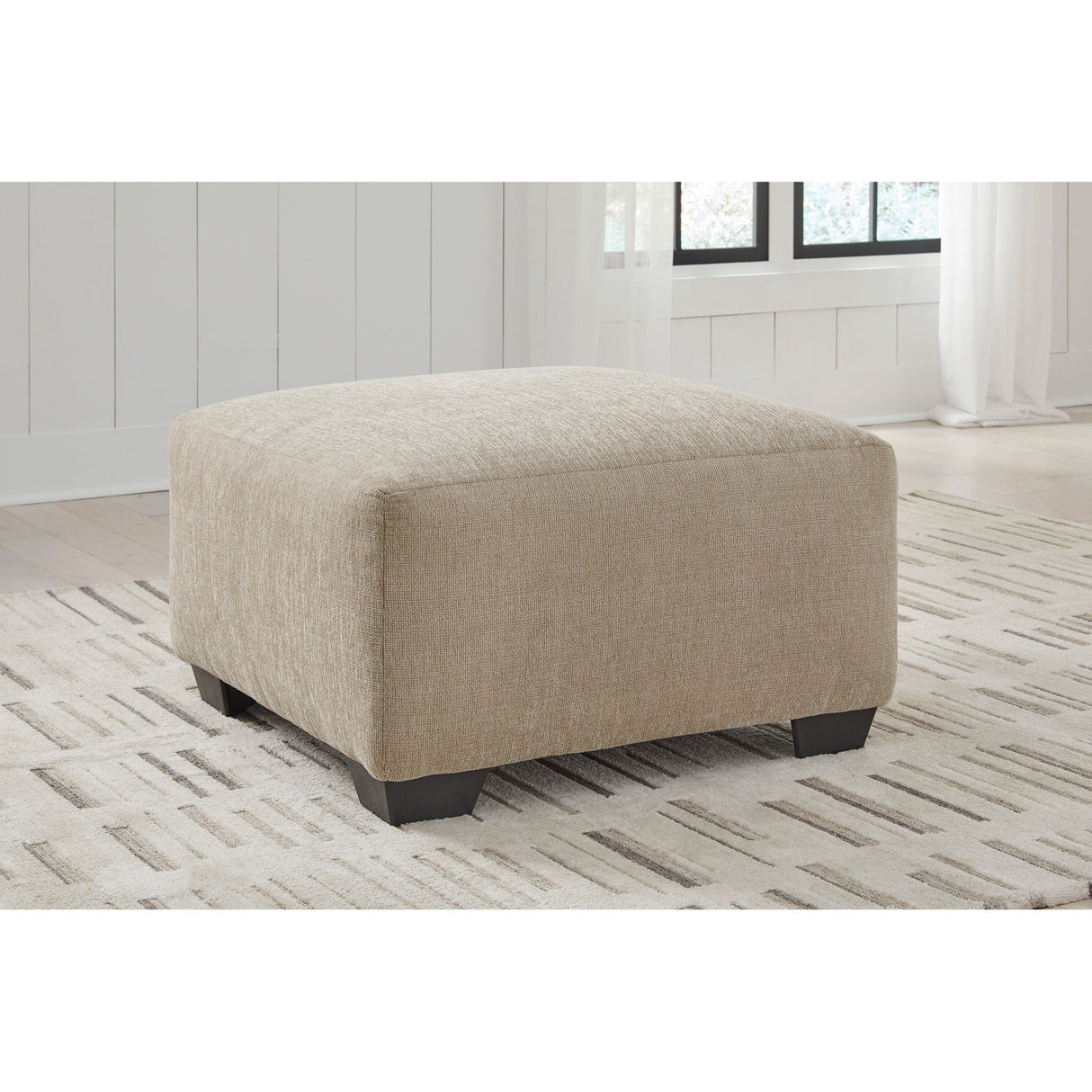 A room setting featuring Brogan Bay Cork Oversized Ottoman