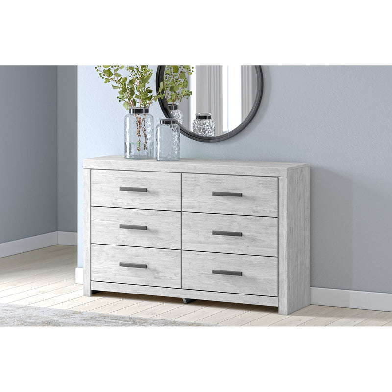 A room setting featuring Cayboni White Dresser