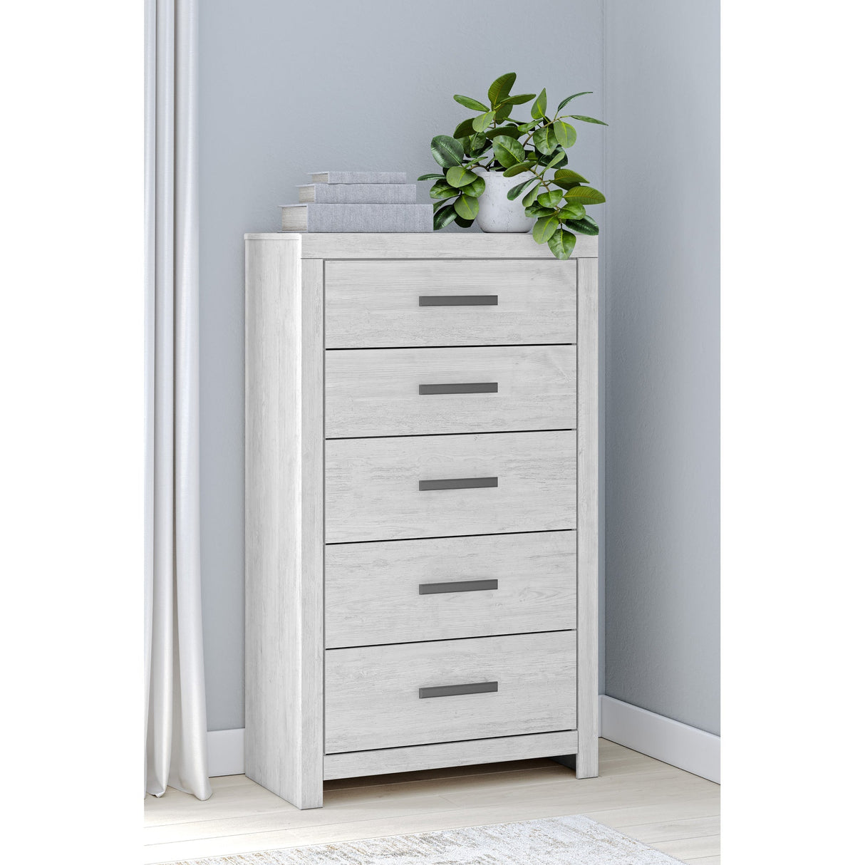 A room setting featuring Cayboni White Chest