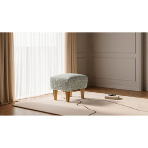 A room setting featuring Riley Cream Ottoman