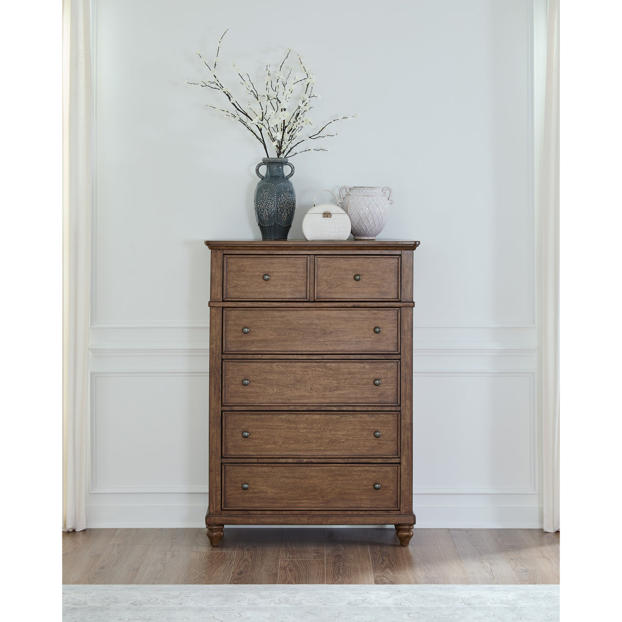 A room setting featuring Paola Chestnut 5 Drawer Chest
