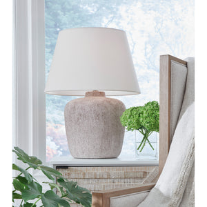 A room setting featuring Danry Distressed Cream Table Lamp