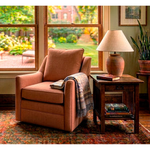 A room setting featuring Aubrey Sienna Swivel Chair
