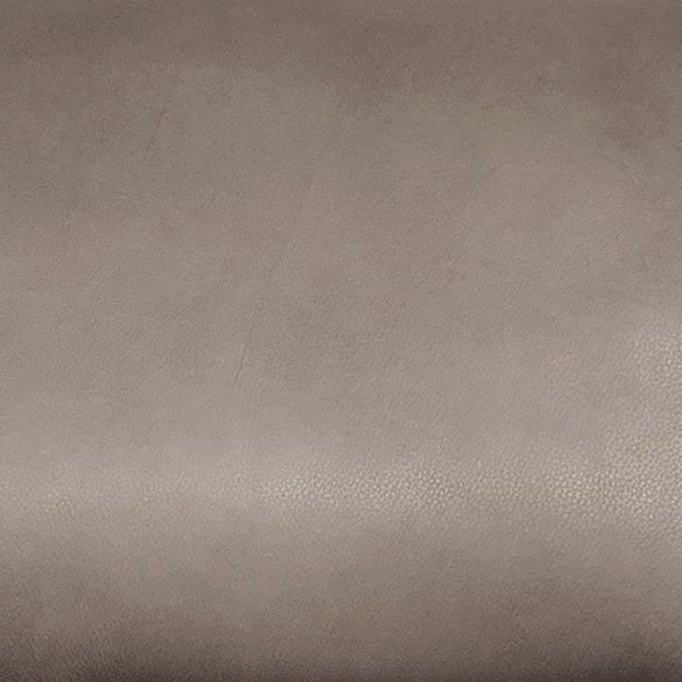 Close-up swatch of a brown leather recliner