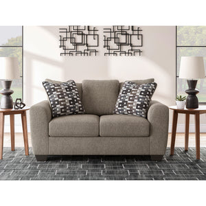 A room setting featuring Triston-Peaks Suede Loveseat
