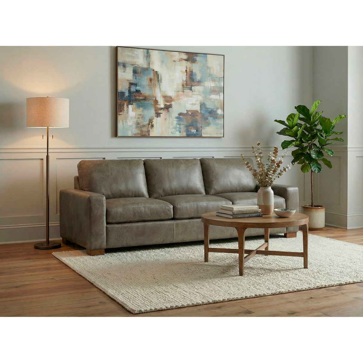 A room setting featuring Juno Gray Feather Blend Oversized Leather Sofa