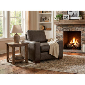 A room setting featuring Juno Gray Feather Blend Leather Chair