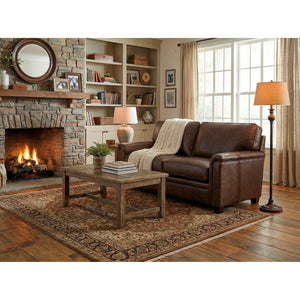 A room setting featuring Warren Chocolate Feather Blend Leather Nail Head Loveseat