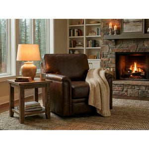 A room setting featuring Warren Chocolate Feather Blend Leather Nail Head Swivel Chair