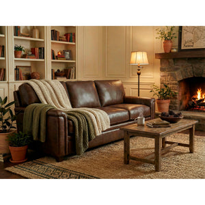 A room setting featuring Warren Chocolate Feather Blend Leather Sofa
