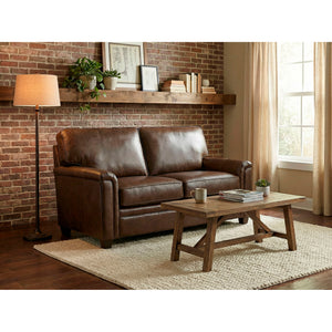 A room setting featuring Warren Chocolate Feather Blend Leather Loveseat