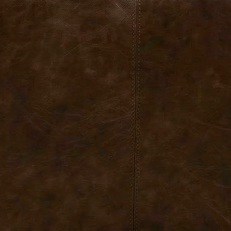 Close-up of brown leather texture with stitching detail