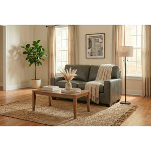 A room setting featuring Merritt Carbone Feather Blend Leather Loveseat