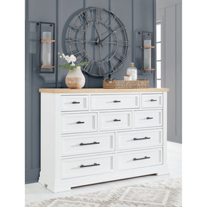A room setting featuring Ashbryn White Dresser