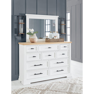 A room setting featuring Ashbryn White Mirror