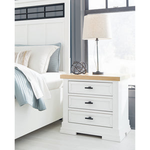 A room setting featuring Ashbryn White 3 Drawer Nightstand