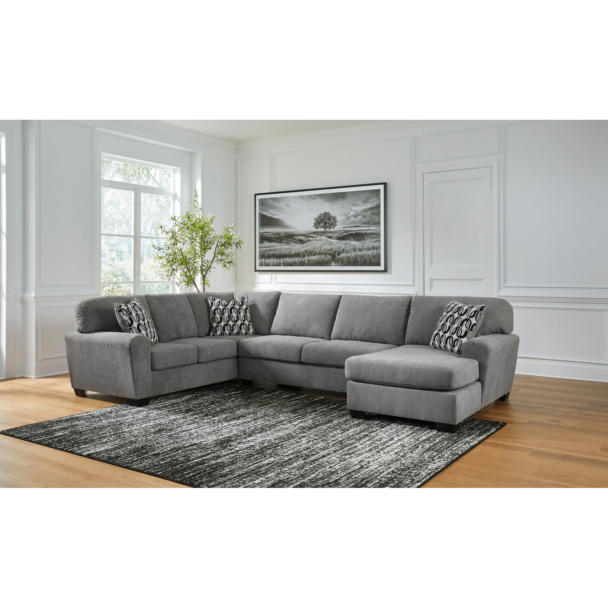 A room setting featuring Birkdale Court Gray 3 Piece Right Chaise Sectional