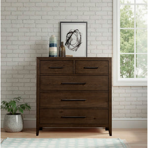 A room setting featuring Norwich Rustic Driftwood Oak 5 Drawer Chest