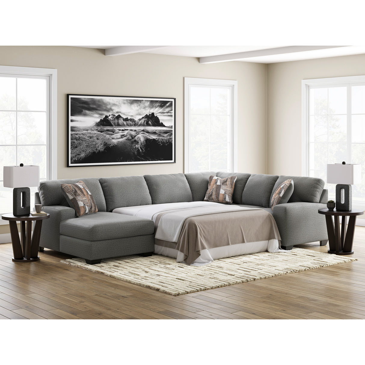 A room setting featuring Full Greystone Seyler Lane 3 Piece Left Chaise Sleeper Sectional