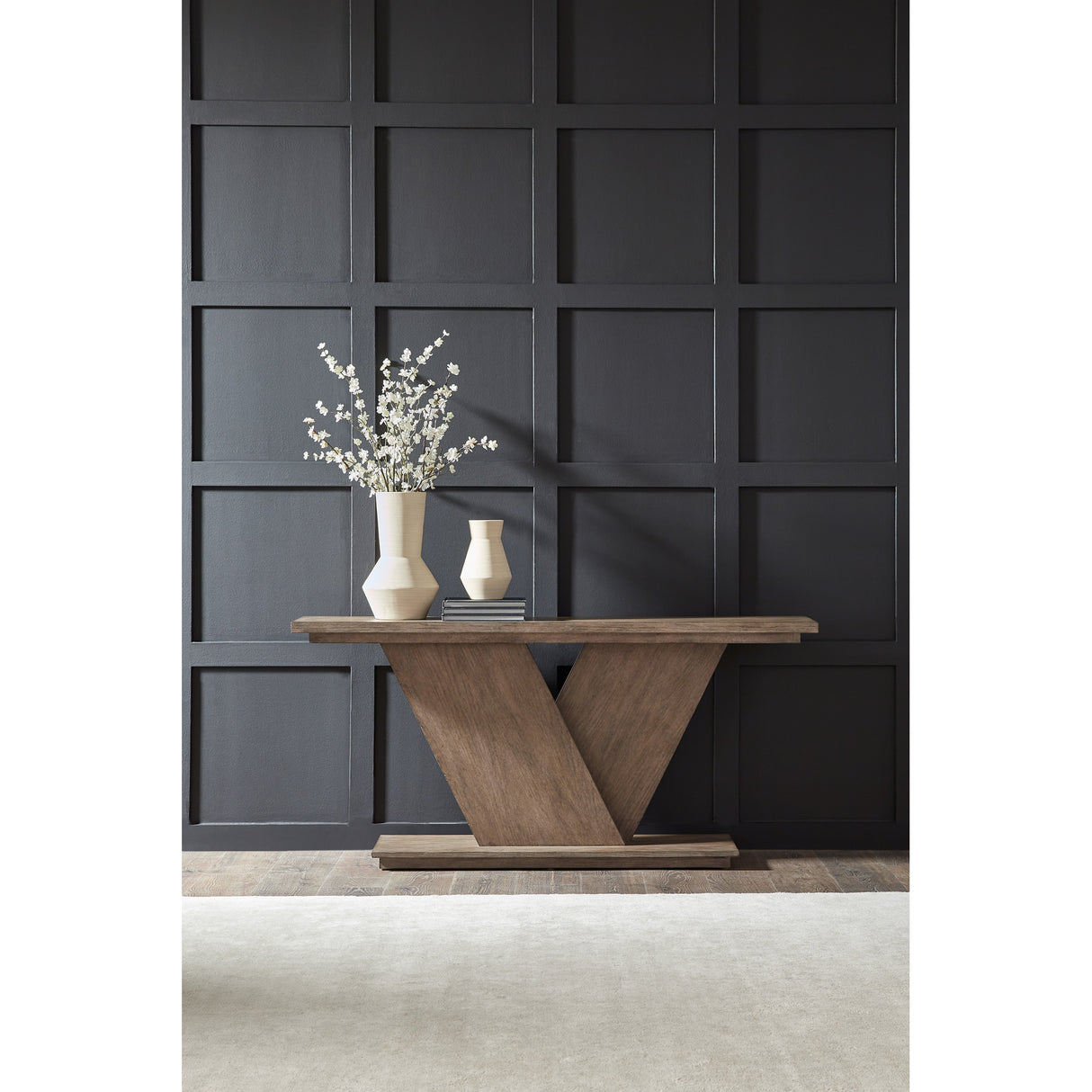 A room setting featuring Aspen Sky Saddle Brown Sofa Table